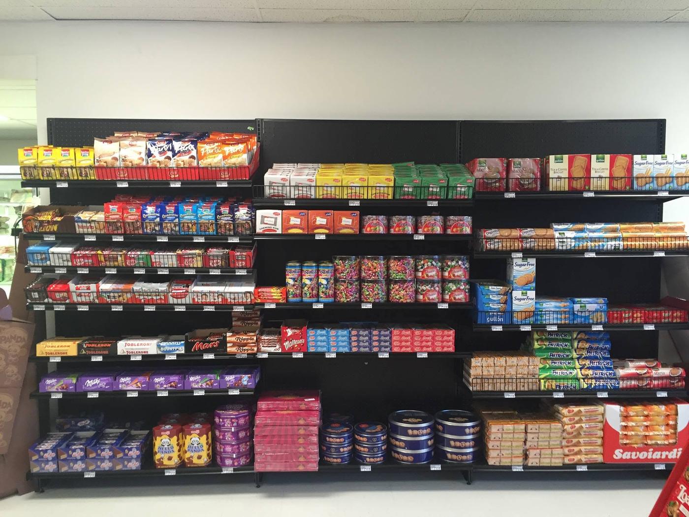 The confectionery run: shelves of European chocolate bars and wafers, tins of butter cookies, sugar free biscuits and jars of wrapped candy.